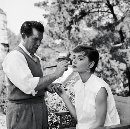 Audrey Hepburn and makeup artist Wally Westmore on the set of Paramount's