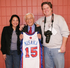 Wat Misaka, the first draft pick of the New York Knicks in 1947, was honored by the New York Knicks at Madison Square Garden on December 20, 2009. He is flanked by filmmakers Christine Toy Johnson and Bruce Alan Johnson. Photo by Lia Chang