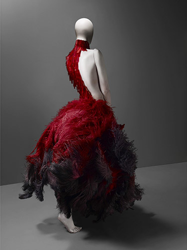 Alexander McQueen (British, 1969–2010), Dress, VOSS, spring/summer 2001, Red and black ostrich feathers and glass medical slides painted red, Courtesy of The Metropolitan Museum of Art, Photograph © Sølve Sundsbø /Art + Commerce