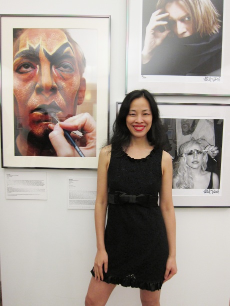 Lia Chang poses in front of her portrait of Thom Sesma's Makeup Transformation as Scar in Disney's The Lion King, at HHC’s New York City: IN FOCUS, Vol. 2 Photo Exhibit opening reception at Bellevue Hospital on June 23, 2011. Photo by Brianne Michelle Photography