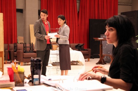 (L-R) James Waterston (Daniel) and Jennifer Lim (Xu Yan) getting a note from Chinglish translator Candace Chong, as director Leigh Silverman looks on in the Healy Room of the Goodman Theatre in Chicago on June 5, 2011 . © 2011 Lia Chang