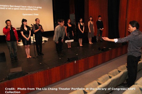 Director Darren Lee stages the curtain call for Robert Lee and Leon Ko’s Heading East at the Lila Acheson Wallace Auditorium at Asia Society in New York. Credit:  Photo from The Lia Chang Theater Portfolio at the Library of Congress/AAPI Collection