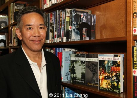 Henry Chang, author of the Chinatown Trilogy, in the Mystery Fiction section of the Mid-Manhattan Library.  Photo by Lia Chang
