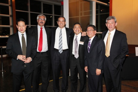 AALDEF 2007 Justice in Action honoree Javade Chaudhri (second from left) and 2011 Justice in Action honoree AB Cruz III (fourth from the left) celebrate the Year of the Dragon with friends and colleagues at AALDEF's Lunar New Year Benefit at Pier Sixty, Chelsea Piers in New York on February 8, 2012. Photo by Lia Chang