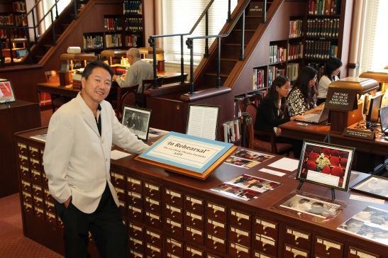 Rick Shiomi with my display of photos “In Rehearsal”, drawn from the Lia Chang Theater Portfolio at the Library of Congress/AAPI Collection. Photo by Lia Chang