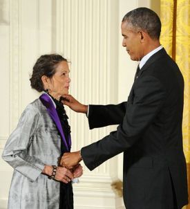President Barack Obama presents the National Medal of Arts to novelist, poet, and essayist Julia Alvarez in a White House ceremony on July 28, 2014. Photo by Jocelyn Augustino.