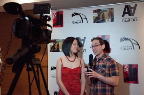 Award-winning filmmakers Lia Chang and Garth Kravits doing interviews on the Red carpet for #AAFLTV and Live at the 11th Annual 72 Hour Shootout Red Carpet Awards Ceremony and wrap party at The Azure in New York on July 25, 2015. Photo courtesy of 72 Hour Shootout/Facebook