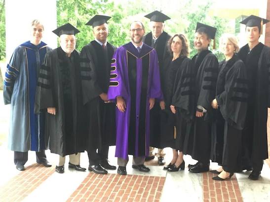 President Falk (center in purple and black robe) with honorary degree recipients Sarah Bolton, Eric Carle, Bryan Stevenson, Frank Deford, Elizabeth Kolbert, David Henry Hwang, Carrie Hessler-Radelet and Leehom Wang at the Williams College 227th Commencement Exercise on June 5, 2016. Photo courtesy of Williams College/Facebook